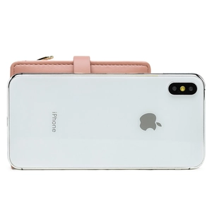 Pink leather wallet size comparison next to an iPhone showing its compact dimensions