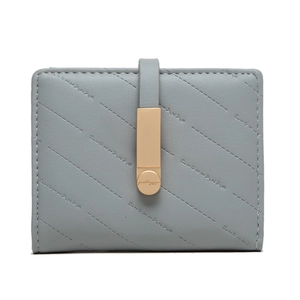 Detail of light blue faux leather wallet with quilted stitching and gold hardware buckle