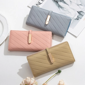 Three elegant long wallets in blue, pink and khaki with textured twill and gold buckle