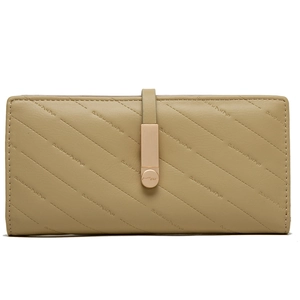 Detail of khaki quilted faux leather long wallet with metal snap closure and textured pattern