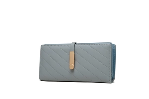 Close-up of grey-blue leather wallet showing diagonal stitching and gold metal buckle