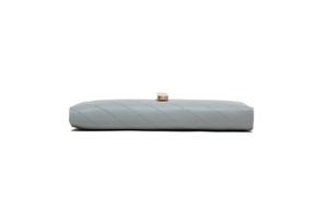 Detailed macro view of grey quilted leather wallet with gold buckle and embossed pattern