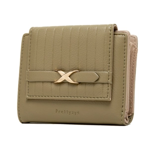 Detail of olive green trifold wallet showing leather texture and gold X-shaped metal buckle