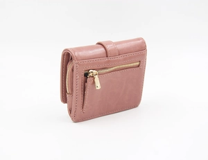 Detail view of pink short bifold wallet with zippered coin compartment and golden zipper