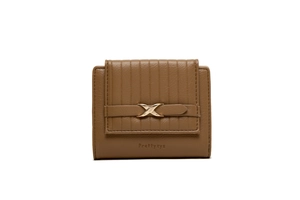 Detail of a small brown PU leather wallet with striped embossing and a gold X metal buckle