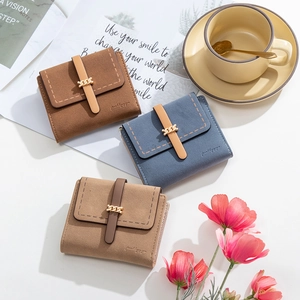 Three frosted vintage trifold wallets with gold metal chain buckle in various colors