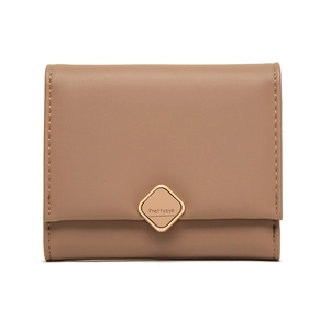Close-up of a women's tri-fold wallet with elegant metal buckle and fine leather texture