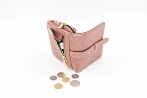 Detail view of pink leather wallet with zip coin pocket and snap closure