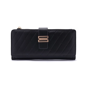 Close-up of black quilted leather wallet with gold metal buckle and brand engraving