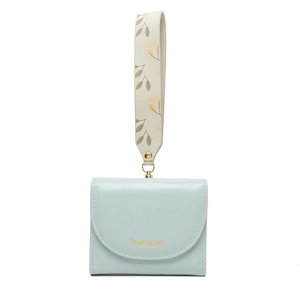Detail of light blue PU leather mini wallet featuring gold logo and leaf print wristlet strap