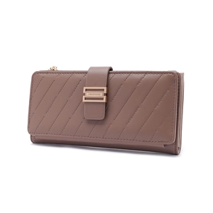 Detail of taupe leather wallet showing champagne gold hardware and quilted texture