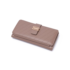 Detailed macro view of the layered structure and gold metal buckle on a leather clutch bag