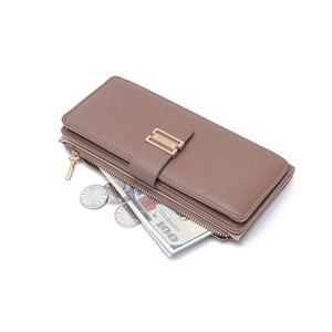 Close-up of brown quilted leather long wallet featuring multiple card slots and coin pocket