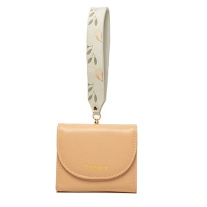 Detail view of a soft PU leather wallet featuring a printed wide wristlet and gold hardware