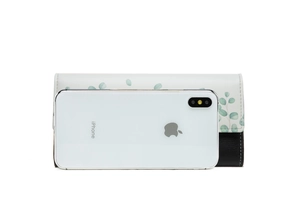 Women's long floral PU leather wallet shown with a smartphone for size reference