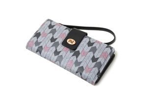 Close-up of long PU leather wallet with chevron pattern and golden metal logo plaque