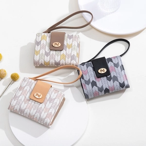 Short tri-fold wallets with geometric chevron prints and a handheld strap detail