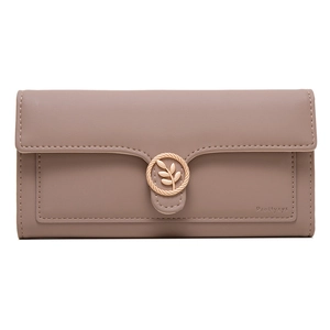Detail of leaf-shaped gold buckle and embossed brand logo on long pink leather wallet