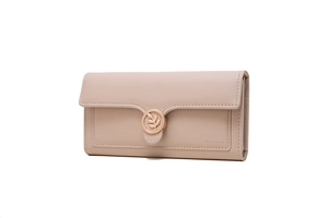 Detail of light beige long wallet with gold leaf buckle and minimalist leather texture