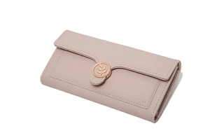 Detailed macro view of long faux leather wallet with golden leaf buckle and embossed logo