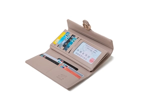 Detail of trifold long wallet in dusty pink with multiple card slots and ID window