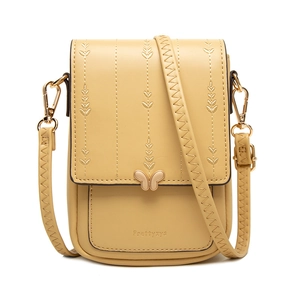 Vue détaillée du sac jaune en cuir PU avec broderie de feuilles et fermoir papillon doré
