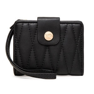Close-up of black quilted leather wallet with gold metal logo clasp and wrist strap