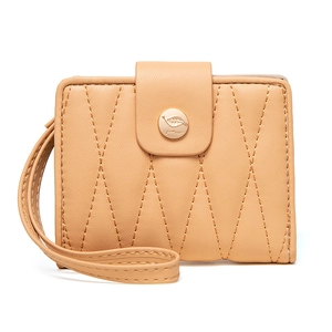 Detail view of apricot quilted leather short wallet with wristlet and gold leaf snap buckle