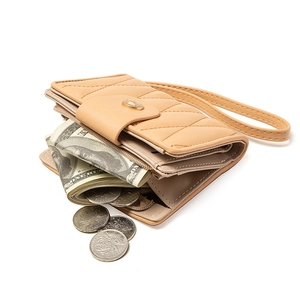 Quilted apricot leather zip-around wallet with wristlet strap and gold metal closure