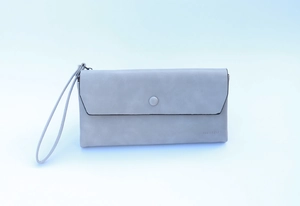 Close-up of light gray matte leather wallet featuring round decorative buckle and wrist strap