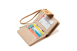 Detailed interior of a beige leather wallet with card slots, ID window, and gold zipper
