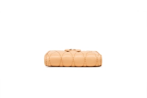 Bottom view of beige quilted leather wallet showing precise stitching and pebble grain texture