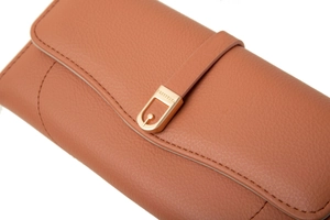 Detailed macro view of brown lychee grain leather wallet with golden logo buckle