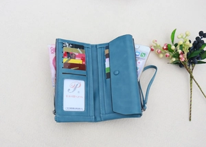 Detailed interior of blue leather long wallet showing card slots and phone compartment