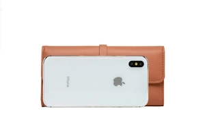 Brown lychee grain leather wallet shown next to a smartphone for scale reference