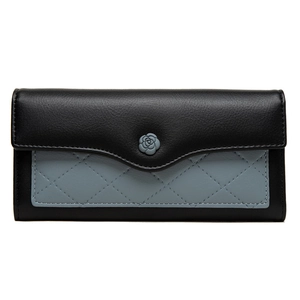 Detail of the quilted blue leather and black flap with a 3D grey camellia flower