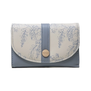 Detail of floral printed PU leather wallet featuring a gold round snap buckle by Prettyzys