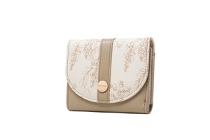 Detailed view of women's tri-fold floral wallet with metal button and elegant stitching