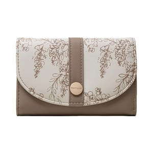Close-up of a two-tone PU leather wallet with vintage floral print and gold metal buckle