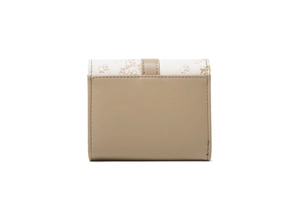 Close-up of compact bi-fold wallet featuring printed patterns and secure snap fastener