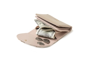 Detail view of pink trifold wallet with compartments for cash, cards, and metal snap coin pocket