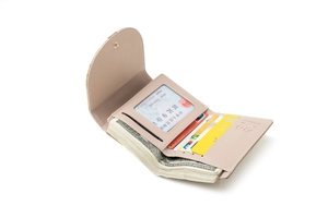 Detailed interior of a beige tri-fold faux leather wallet with full card slots and cash
