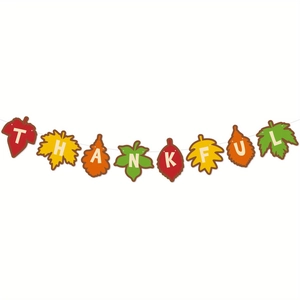 Detail of colorful autumn leaves banner featuring white letters spelling THANKFUL