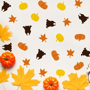 Thanksgiving confetti set with maple leaves, pumpkins, and turkey silhouettes for table decor