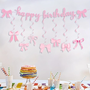 Pink glitter Happy Birthday banner with bow-themed hanging swirls for party decoration