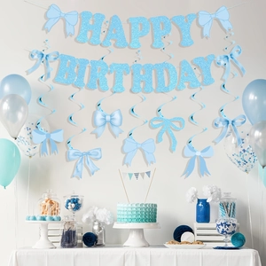 Light blue Happy Birthday banner with glitter letters and hanging ribbon bow swirls