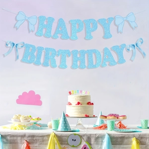 Blue glitter Happy Birthday banner with bows and party decorations in a set