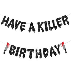 Detail of glittery Have A Killer Birthday Halloween banner with bloody knife accents