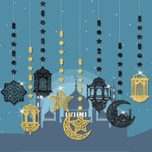 Glittery gold and black Ramadan hanging ornaments with star, moon and lantern shapes