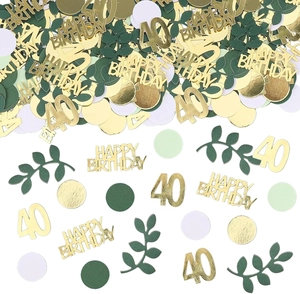 Detail of 40th birthday table confetti with gold metallic text and green paper leaves